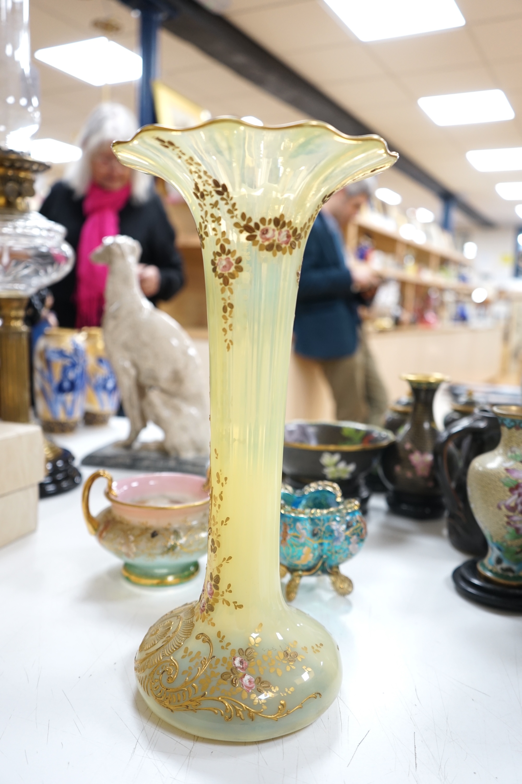 Three Bohemian gilt decorated glass vessels, including two Moser bowls and a tall Vaseline vase, 34.5cm high. Condition - good.